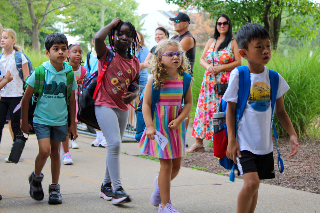 group of students walk into school