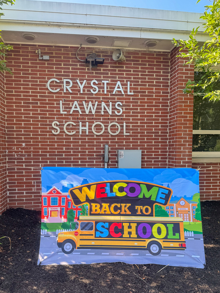 Sign in front of school says Welcome back to school