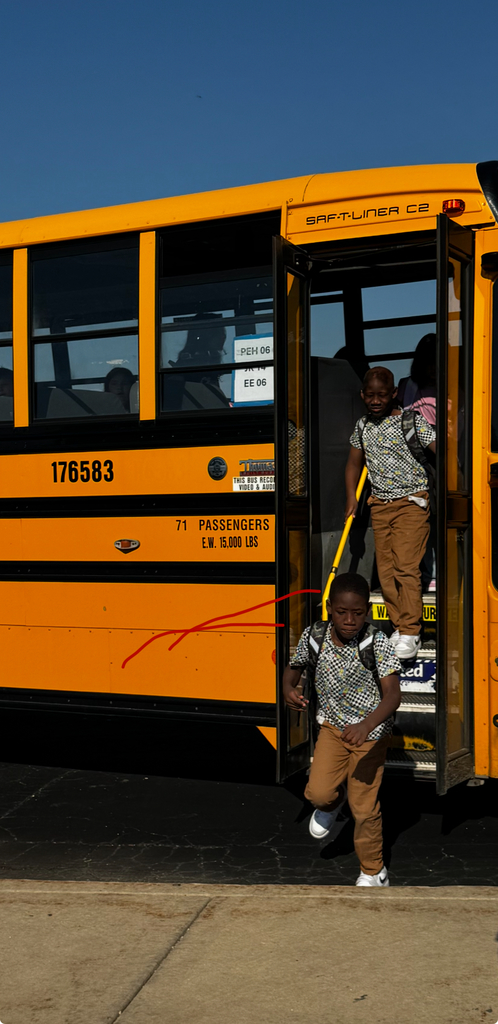 kids getting off of bus
