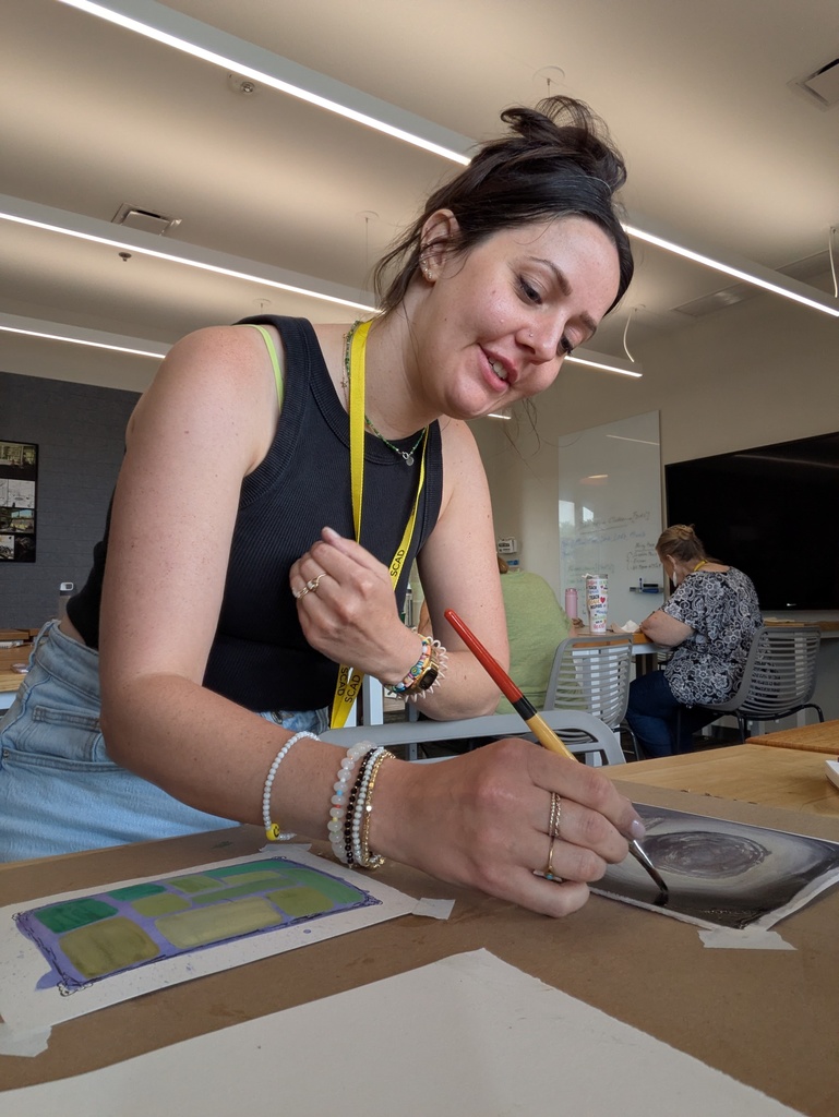PEHS art teacher Lizzy Pankau painting at an art conference in Georgia.