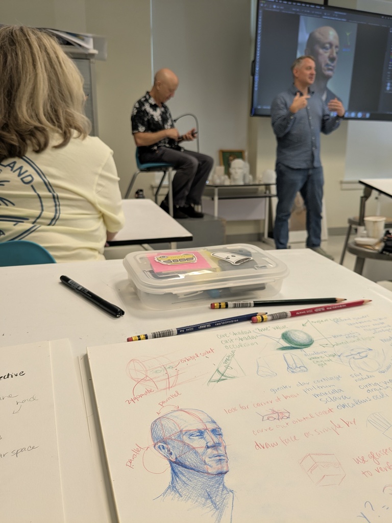 speakers talking at an art conference