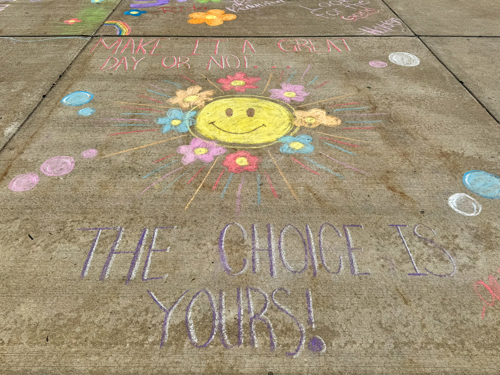 sidewalk chalk with sun and flowers. Make it a great day or not, the choice is yours!