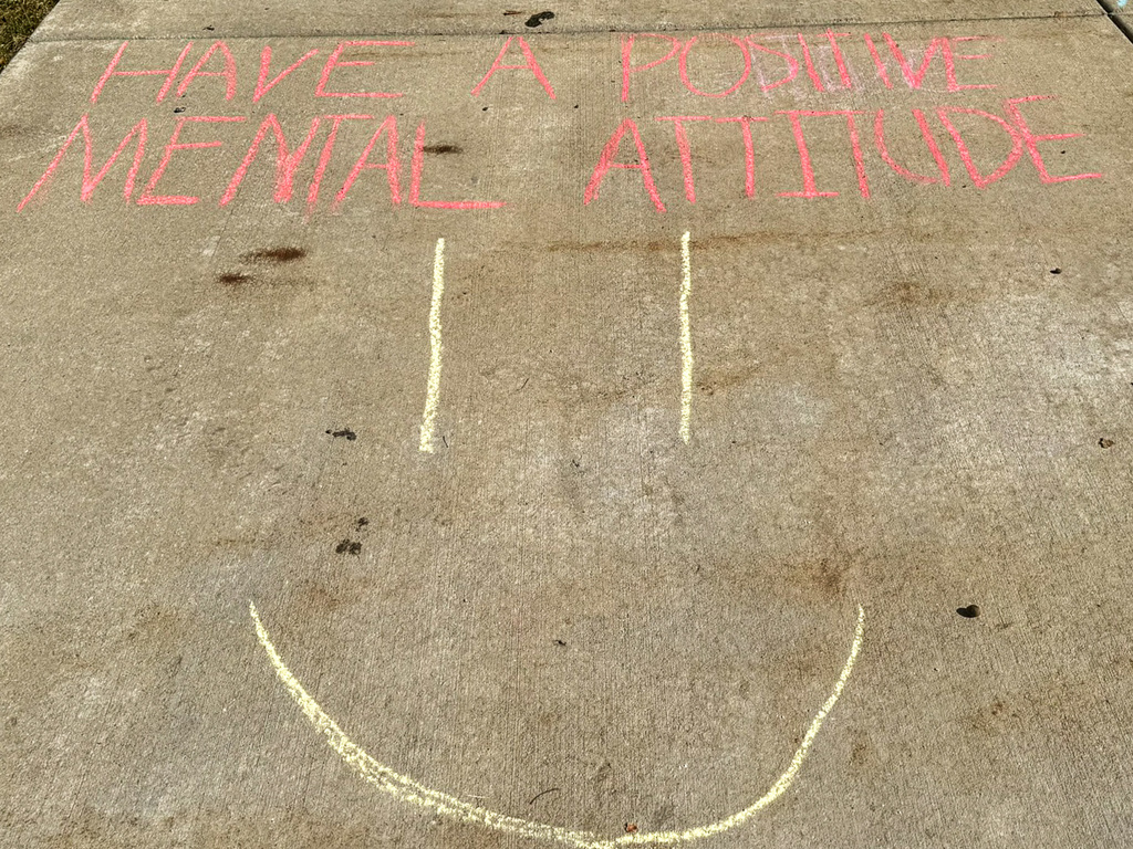 Have a positive mental attitude  sidewalk chalk smiley face