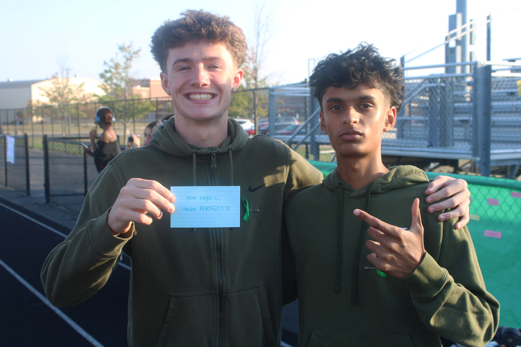 PEHS students with note that says never forget you're perfect.