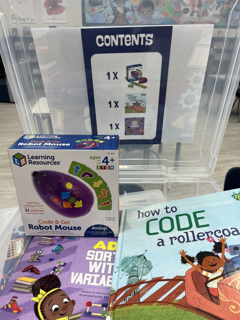 Two books and a mouse robot.