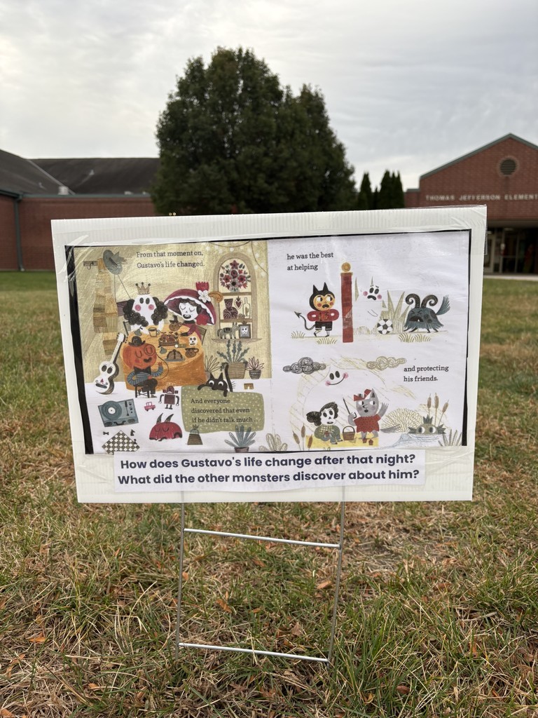 A sign with a book pages and questions is in the grass.