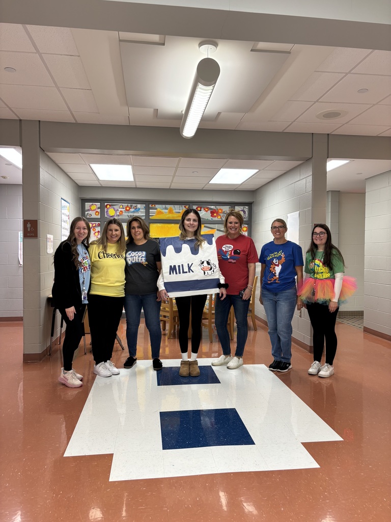 Seven teachers dressed as cereal for Halloween.