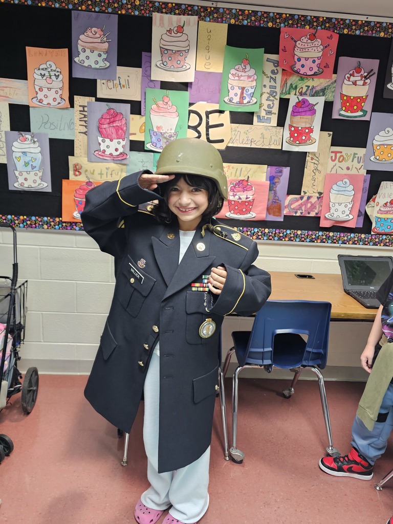 Students try on teacher's uniform