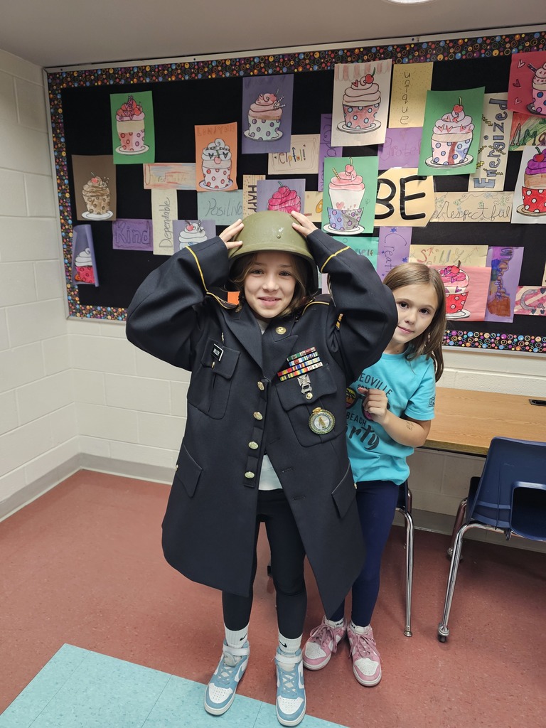 Students try on teacher's uniform