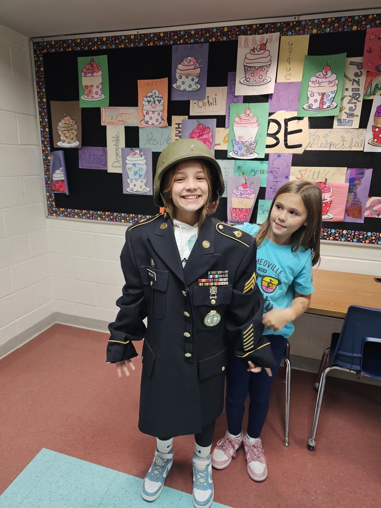 Students try on teacher's uniform