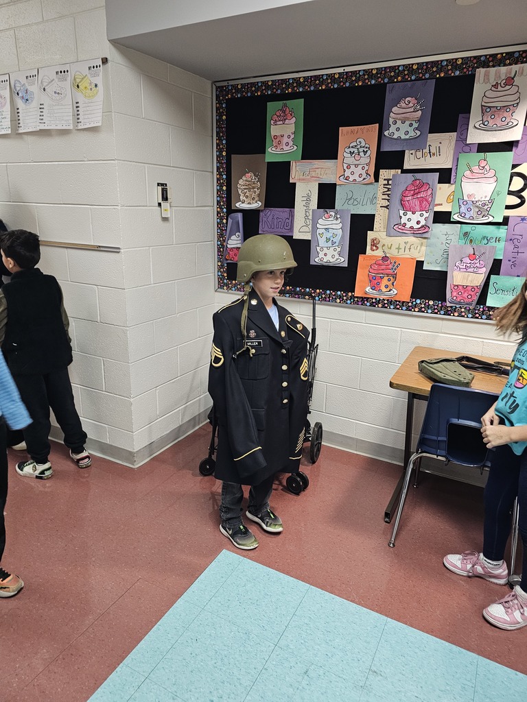 Students try on teacher's uniform