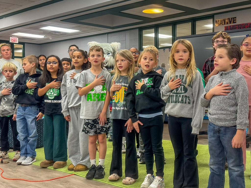 group of students say Pledge of Alligence