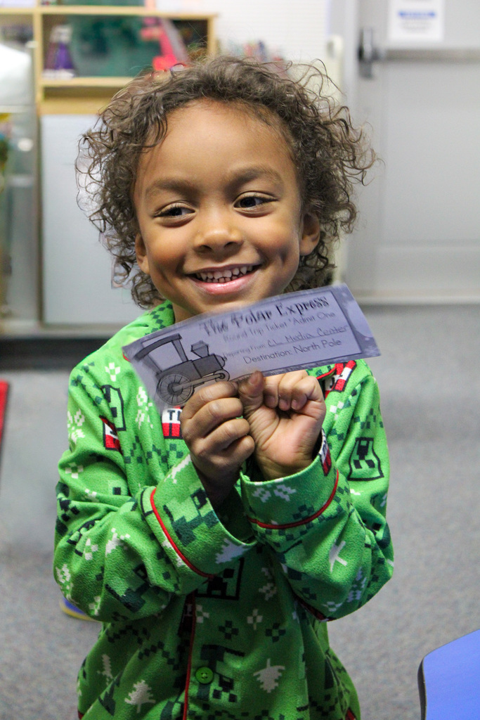 kindergarten student holds ticket to Polar Express