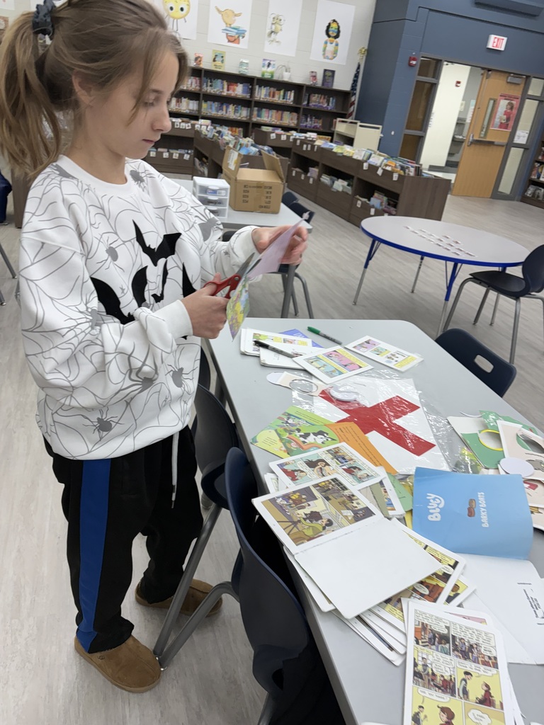 Students makingbuttons in a library.