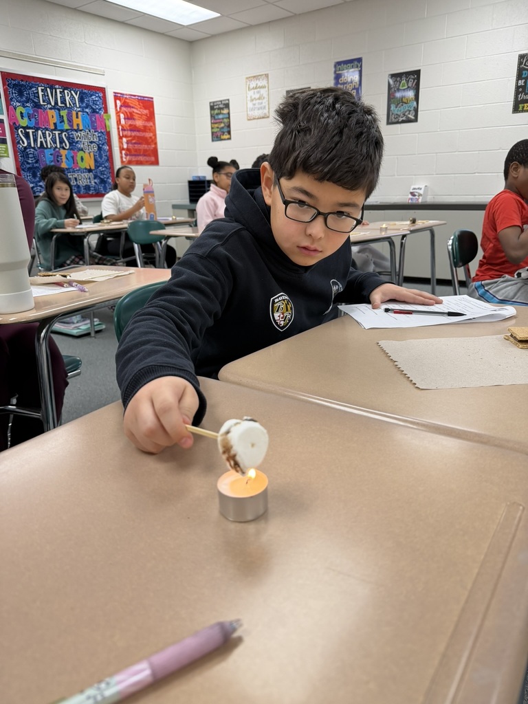 Ira Jones MS students conducting a science activity using s'mores