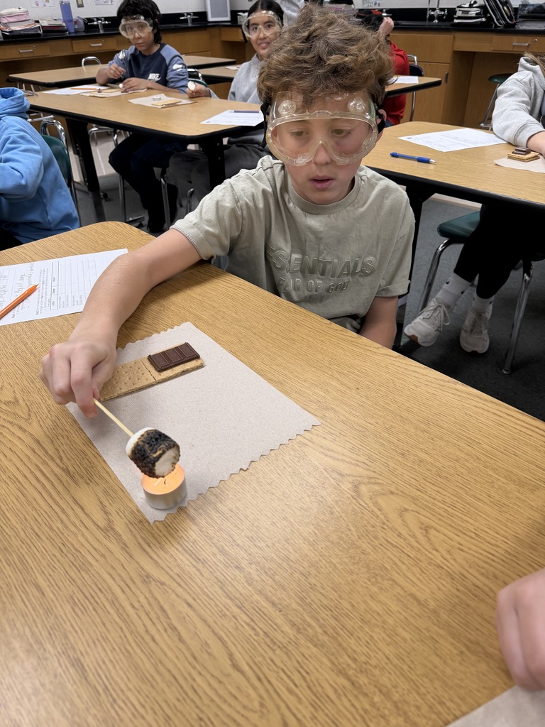 Ira Jones MS students conducting a science activity using s'mores