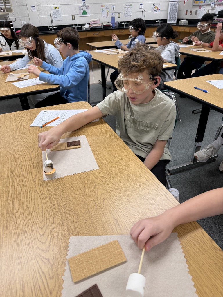 Ira Jones MS students conducting a science activity using s'mores