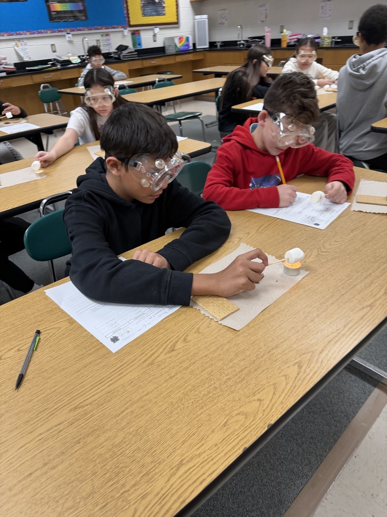 Ira Jones MS students conducting a science activity using s'mores