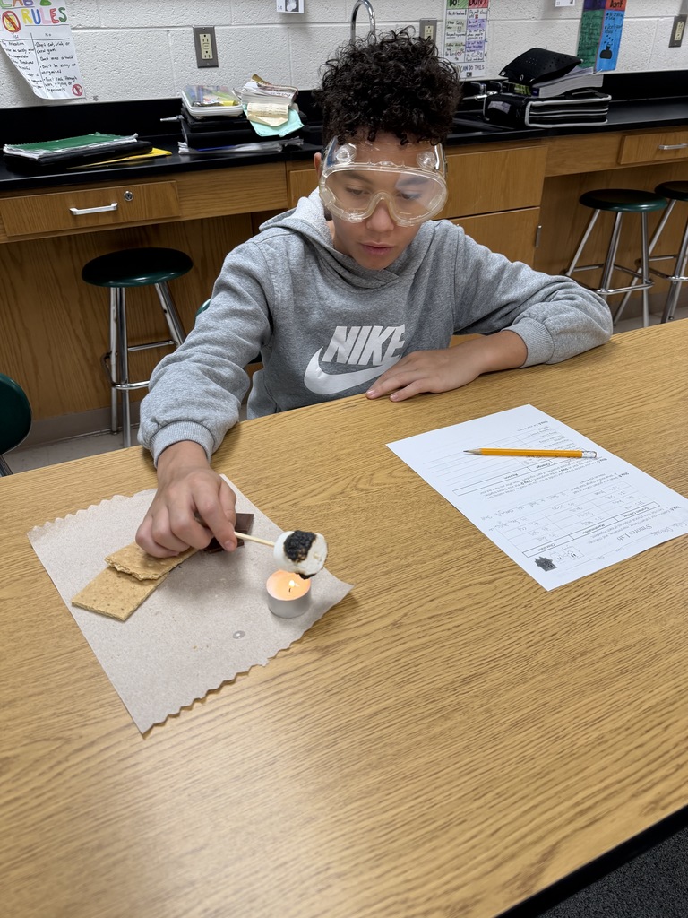 Ira Jones MS students conducting a science activity using s'mores
