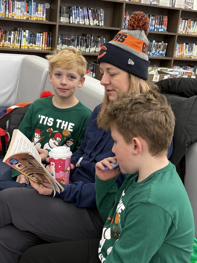 A family reading in the media center. 