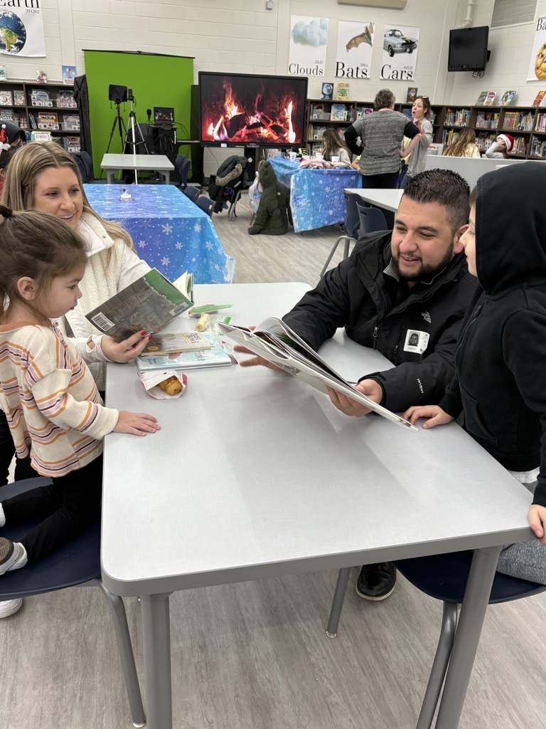 A family reading in the media center. 