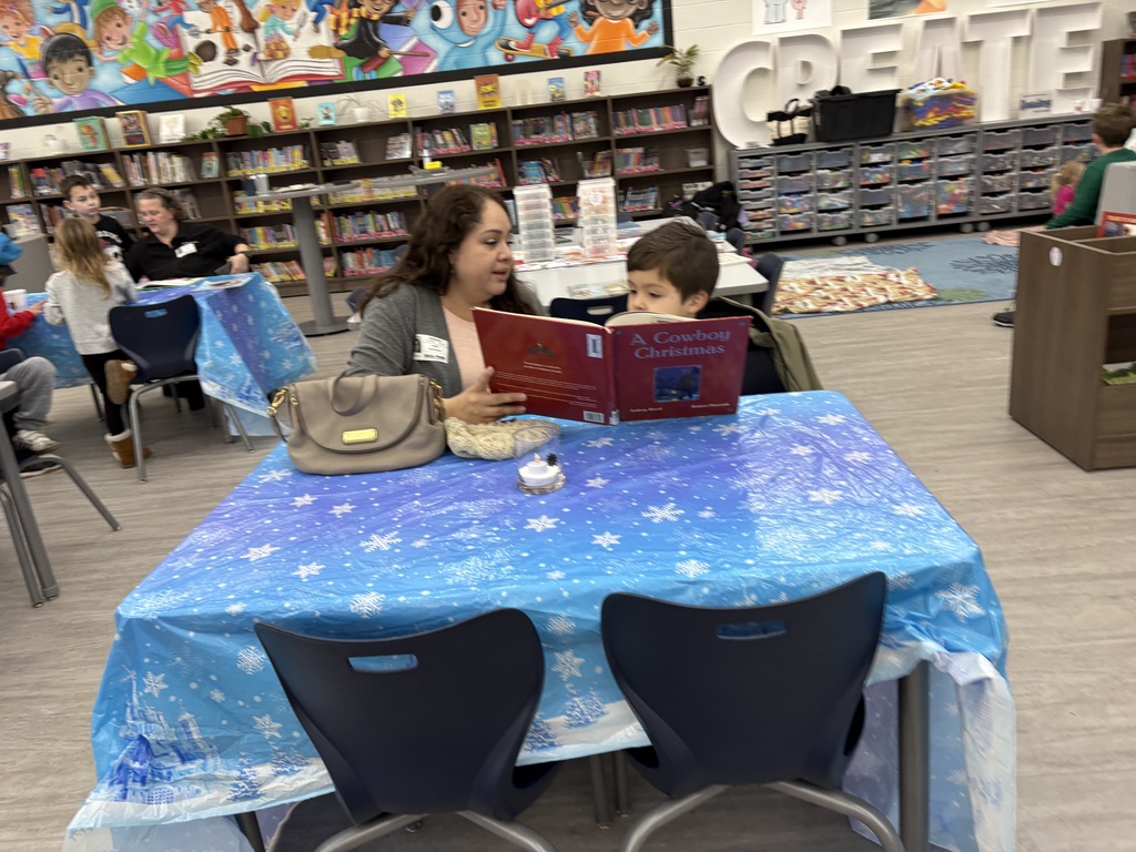 A family reading in the media center. 