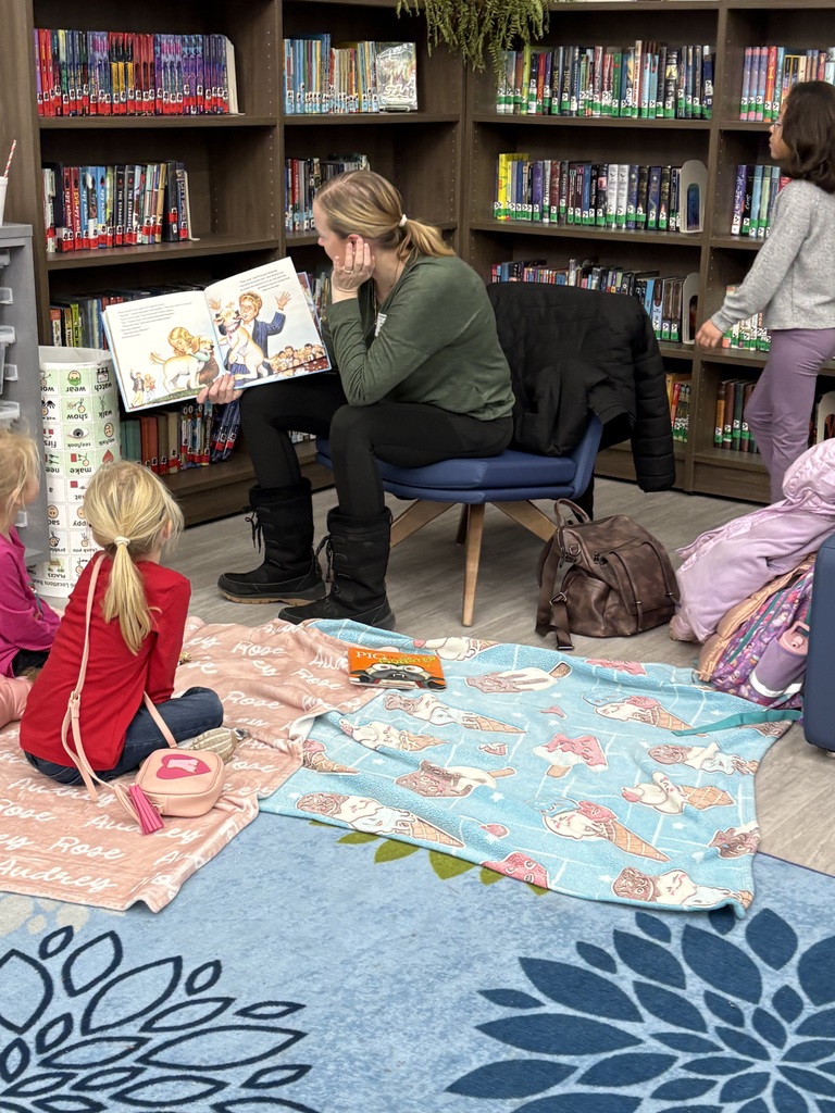 A family reading in the media center. 