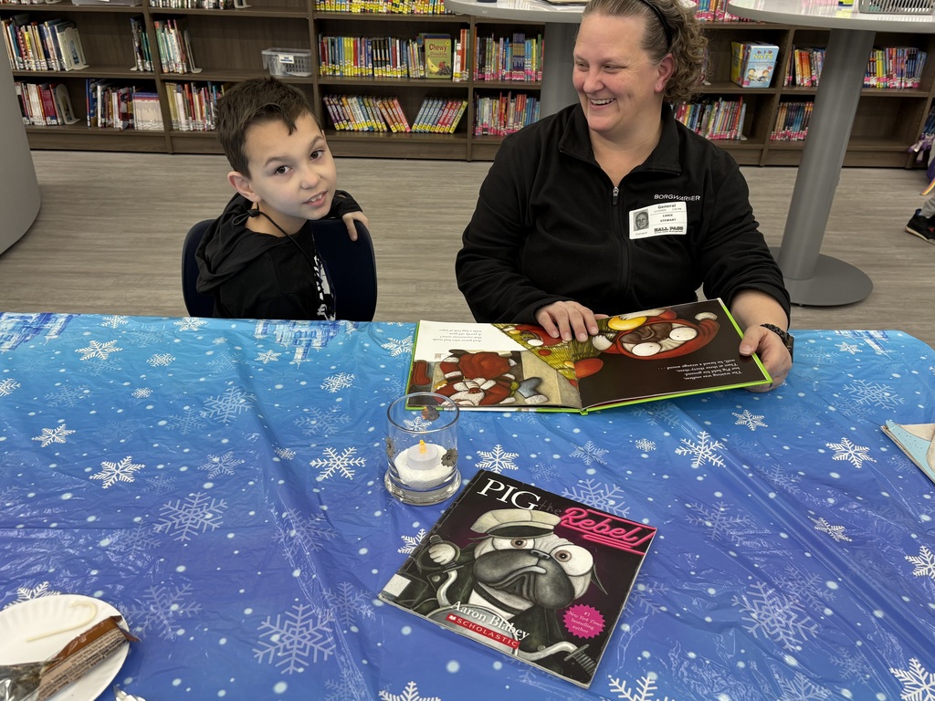 A family reading in the media center. 