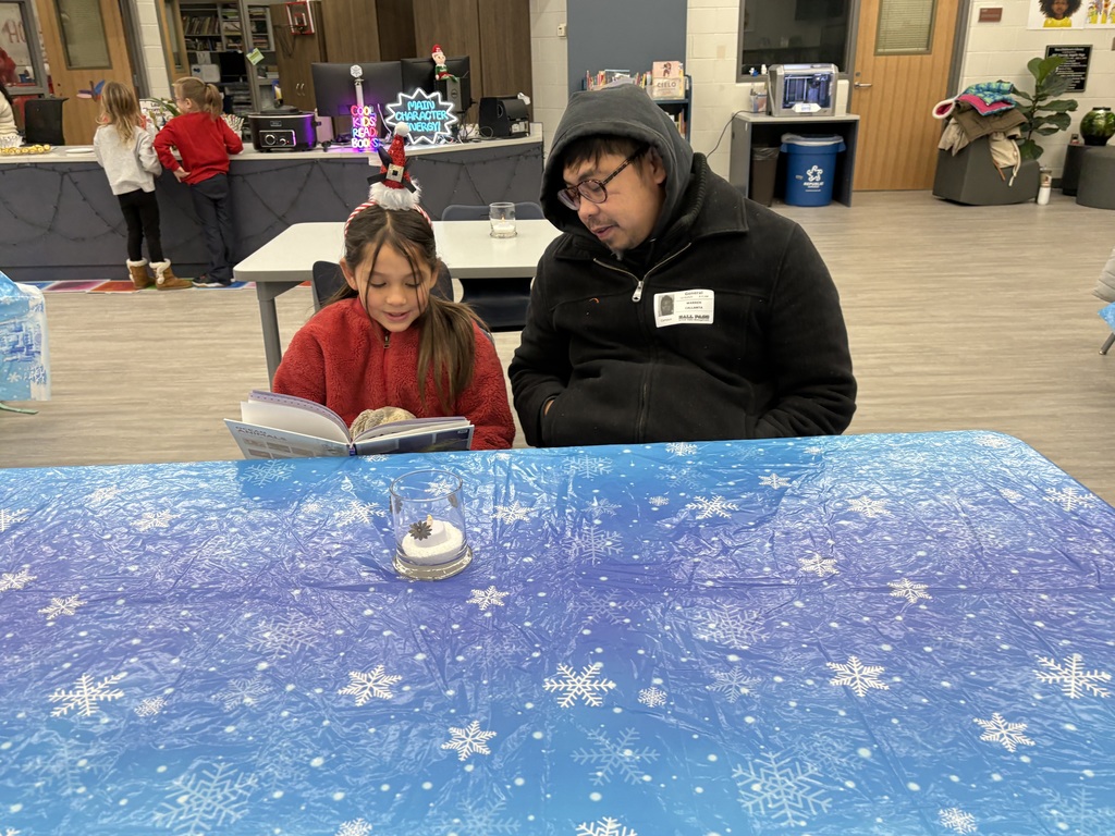 A family reading in the media center. 