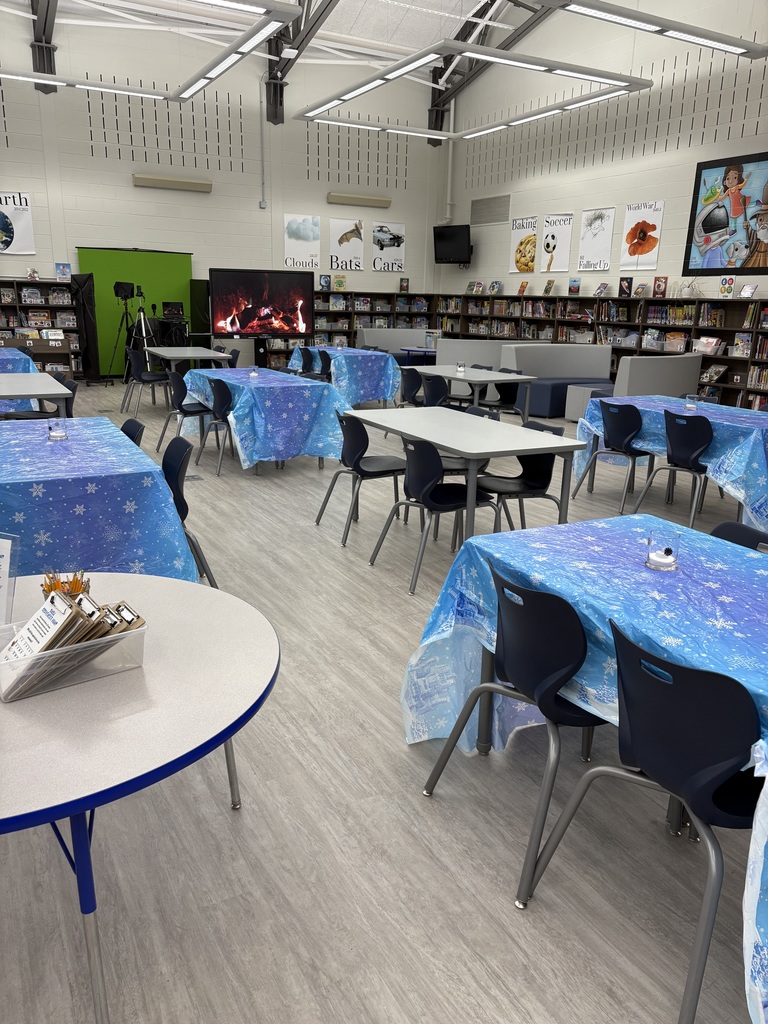 A family reading in the media center. 