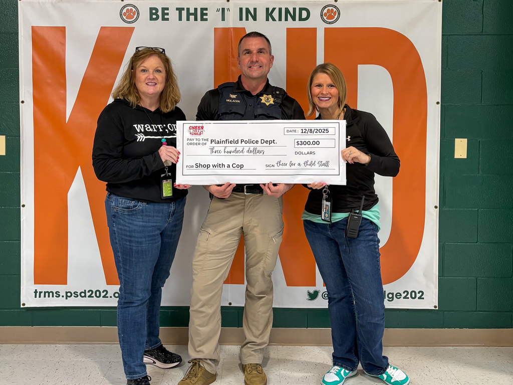three people stand middle police officer holds oversized check for $300