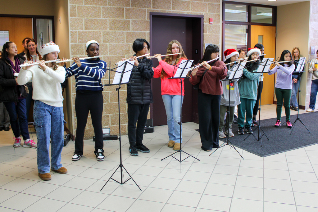 seven students play flutes