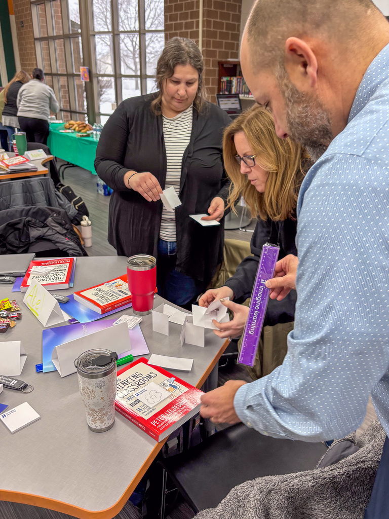 three people perform exercise during professional development