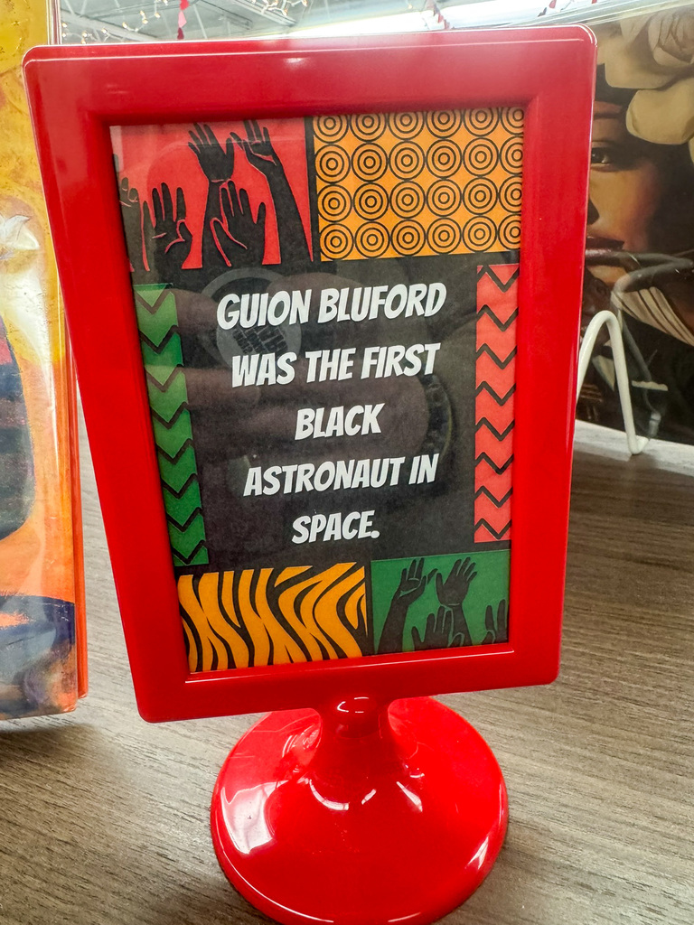 red frame post card with an african background Guion Bluford was the first black astronaut in space