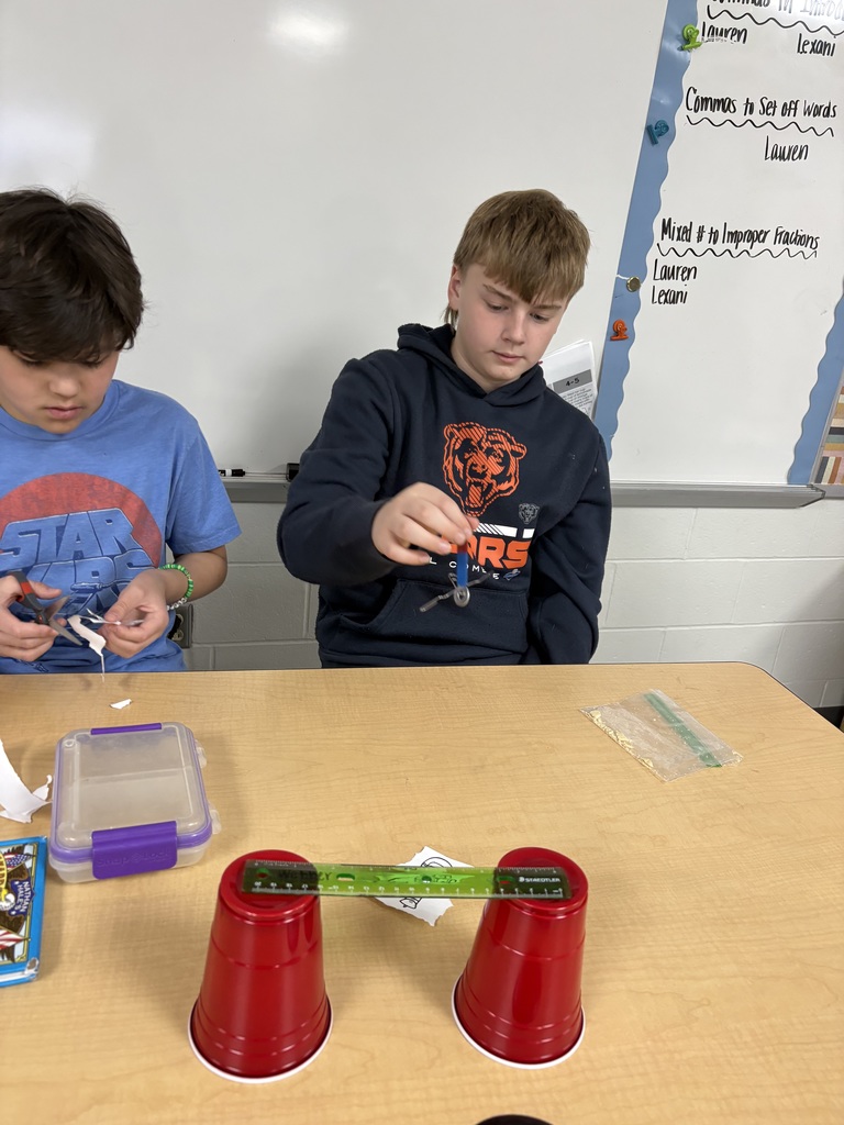 Students cutting paper. 