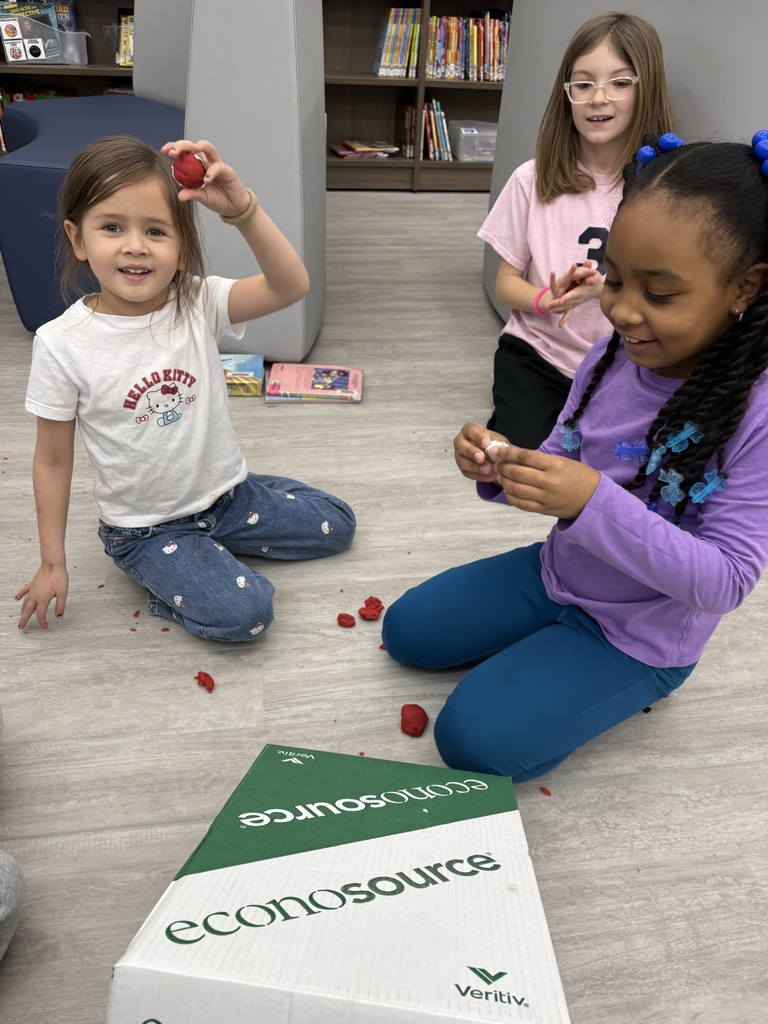 Students experiment with clay and rocks to test force and motion. 