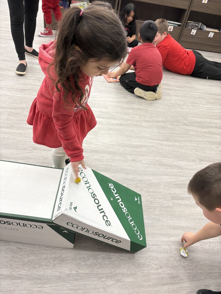 Students experiment with clay and rocks to test force and motion. 