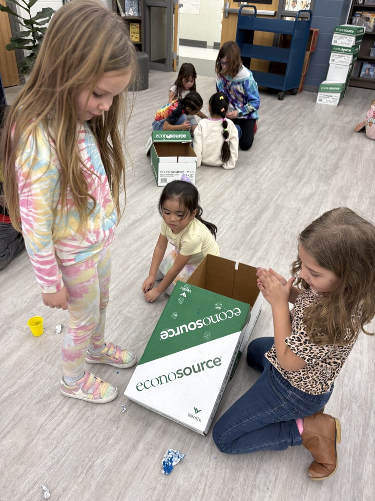 Students experiment with clay and rocks to test force and motion. 