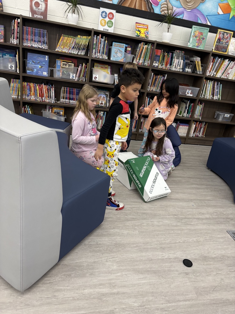 Students experiment with clay and rocks to test force and motion. 
