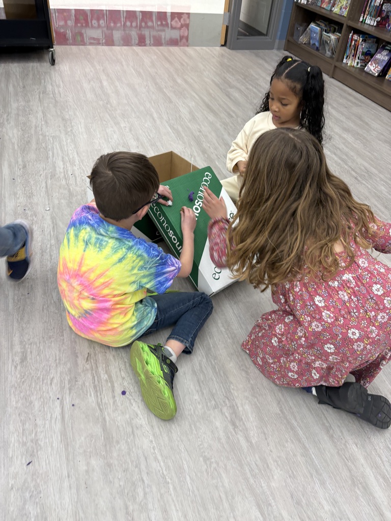 Students experiment with clay and rocks to test force and motion. 