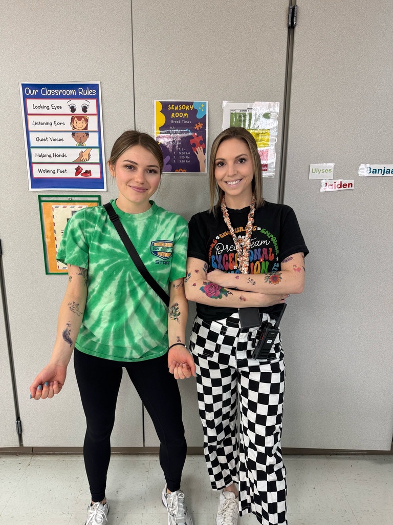 Eichelberger admin, teachers and staff show off their fake tattoos as part of a school fundraiser.