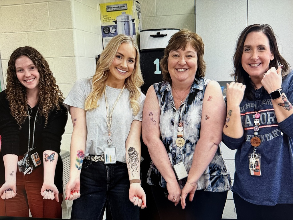 Eichelberger admin, teachers and staff show off their fake tattoos as part of a school fundraiser.