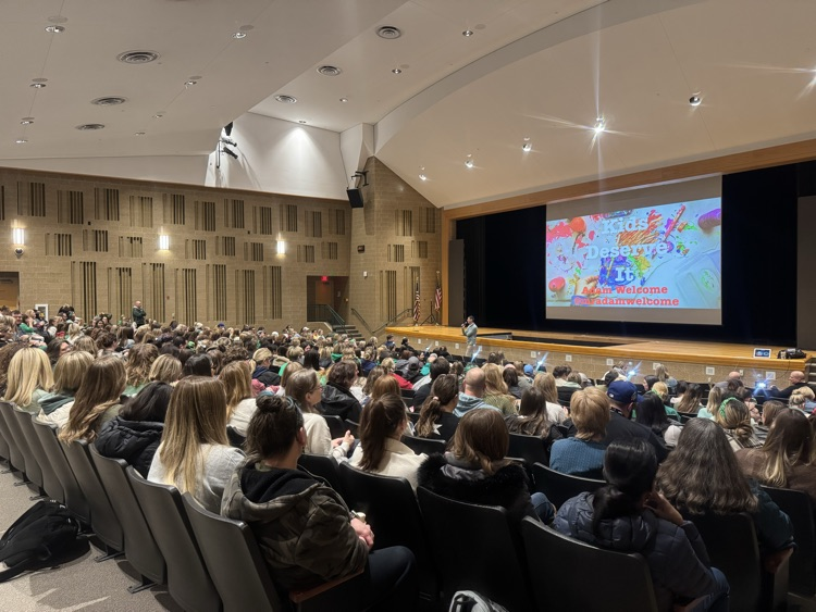 group of teachers and staff in auditorium 