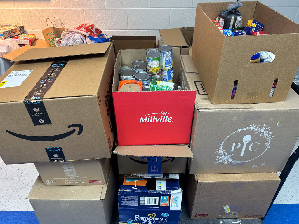 canned good in boxes in a hallway