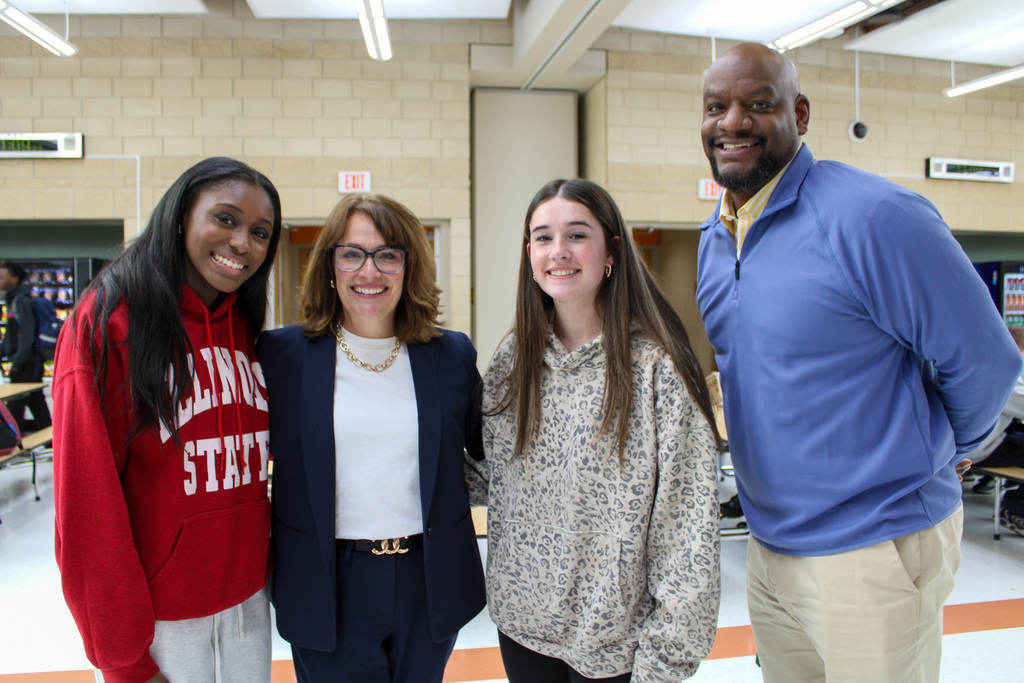 two students pose for a photos with Illinois State Senator Meg Cappel and Plainfield East high School principal Kai Freeman