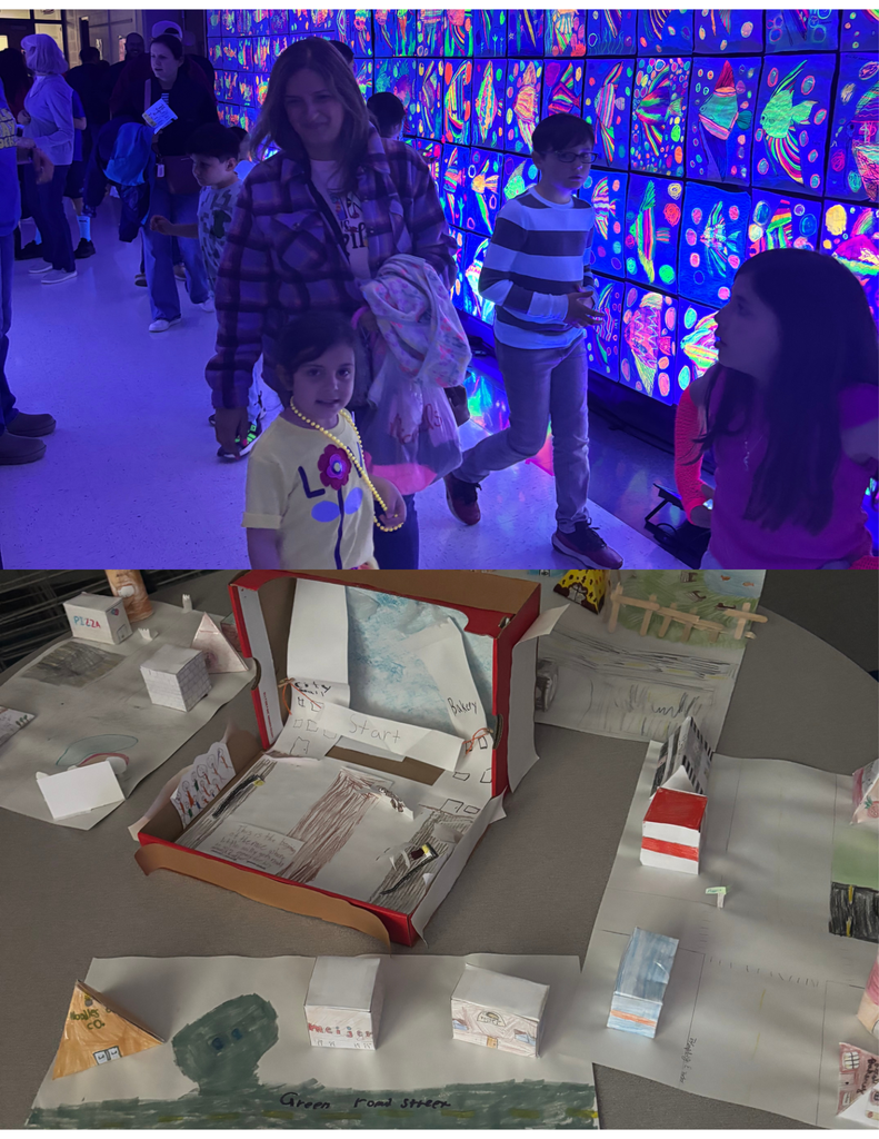 Student projects on display and families walking in a hallway with glow in the dark art.