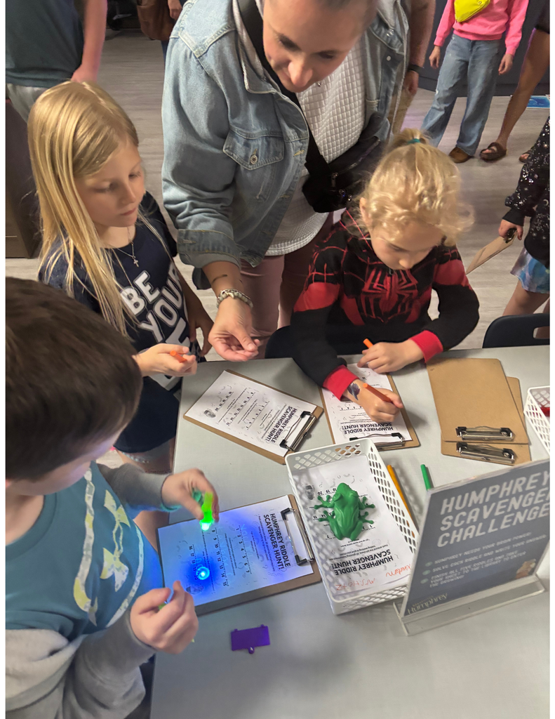 Three students working on a scavenger hunt.