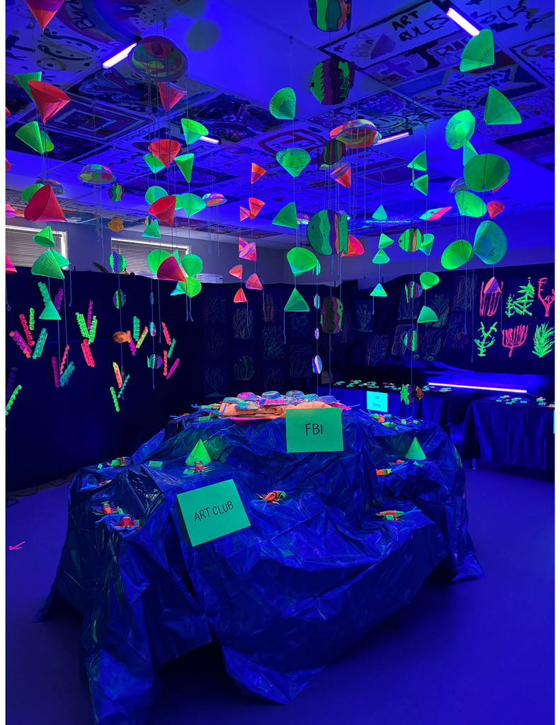 Glow in the dark art in a school classroom.