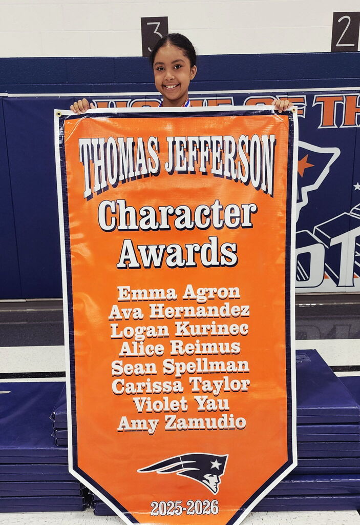 A student holding a banner. 