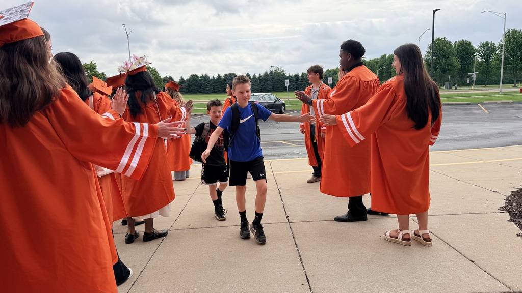 Former Eichelberger ES students walk the halls in their caps and gowns